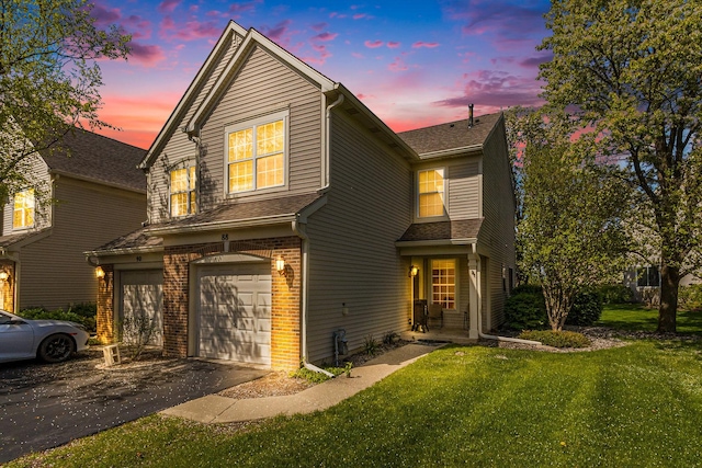 88 Keeneland Ct, Grayslake, IL 60030 - traditional home featuring a garage, driveway, a front lawn, and brick siding