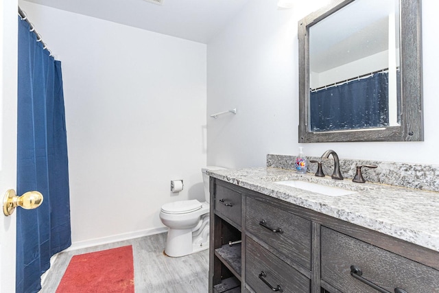 88 Keeneland Ct, Grayslake, IL 60030 - bathroom featuring wood finished floors, vanity, toilet, and baseboards