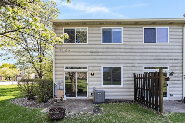 88 Keeneland Ct, Grayslake, IL 60030 - back of house with central AC unit, an outdoor fire pit, a yard, and a patio area