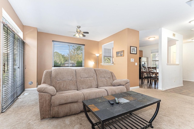 88 Keeneland Ct, Grayslake, IL 60030 - living room with carpet, a ceiling fan, baseboards, and healthy amount of natural light