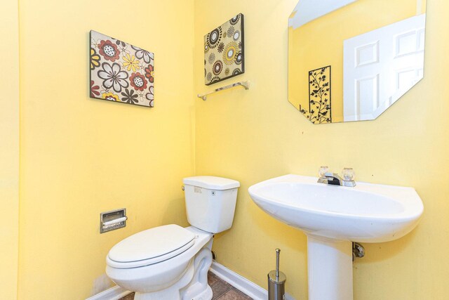 88 Keeneland Ct, Grayslake, IL 60030 - half bath featuring toilet, baseboards, and tile patterned flooring