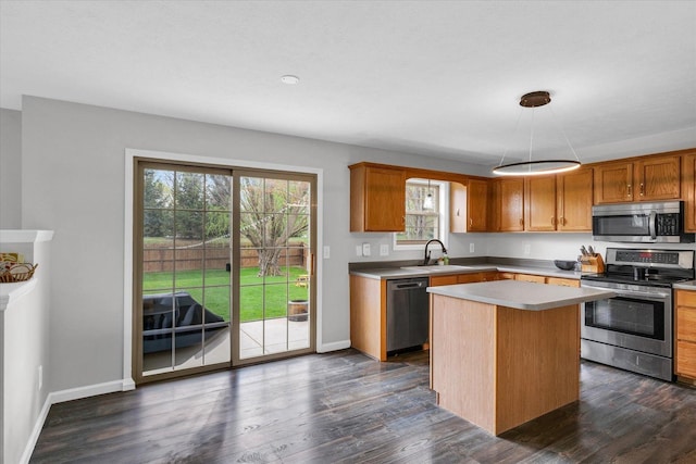 3410 Waterville Ct, Champaign, IL 61822 - kitchen featuring baseboards, stainless steel appliances, dark wood-style floors, and light countertops