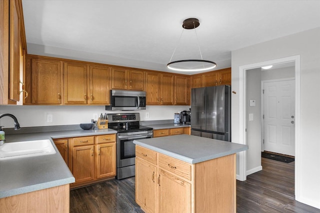 3410 Waterville Ct, Champaign, IL 61822 - kitchen with a center island, dark wood-style floors, a sink, and appliances with stainless steel finishes