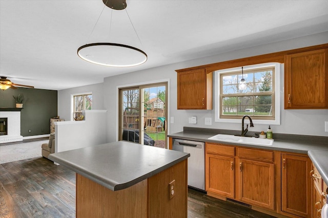 3410 Waterville Ct, Champaign, IL 61822 - kitchen with dishwasher, visible vents, a sink, dark wood-type flooring, and brown cabinetry