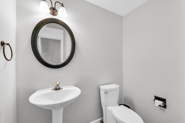 3410 Waterville Ct, Champaign, IL 61822 - half bathroom with toilet, a sink, and baseboards