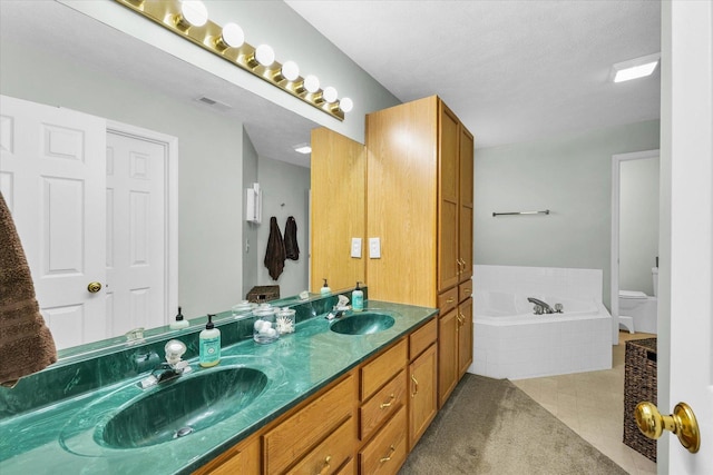 3410 Waterville Ct, Champaign, IL 61822 - full bathroom featuring a bath, visible vents, a sink, and toilet
