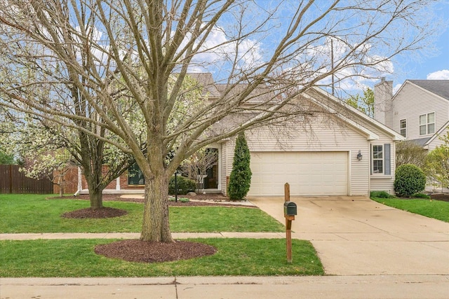3410 Waterville Ct, Champaign, IL 61822 - view of front of home with an attached garage, a front lawn, fence, and driveway