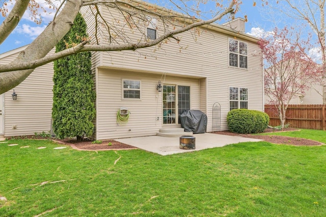 3410 Waterville Ct, Champaign, IL 61822 - back of property with fence, a patio area, a lawn, and a chimney