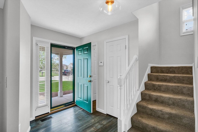 3410 Waterville Ct, Champaign, IL 61822 - entryway featuring dark wood-type flooring, stairway, a wealth of natural light, and visible vents