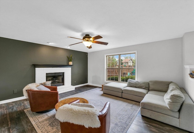 3410 Waterville Ct, Champaign, IL 61822 - living room with baseboards, wood finished floors, a brick fireplace, and ceiling fan