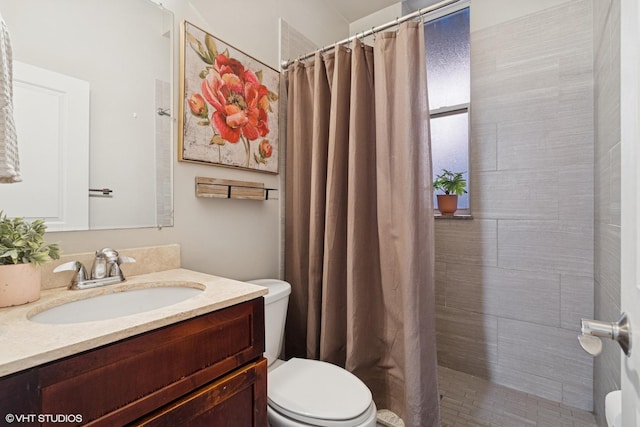 1019 N Washtenaw Ave Unit 2, Chicago, IL 60622 - bathroom featuring toilet, vanity, and a tile shower