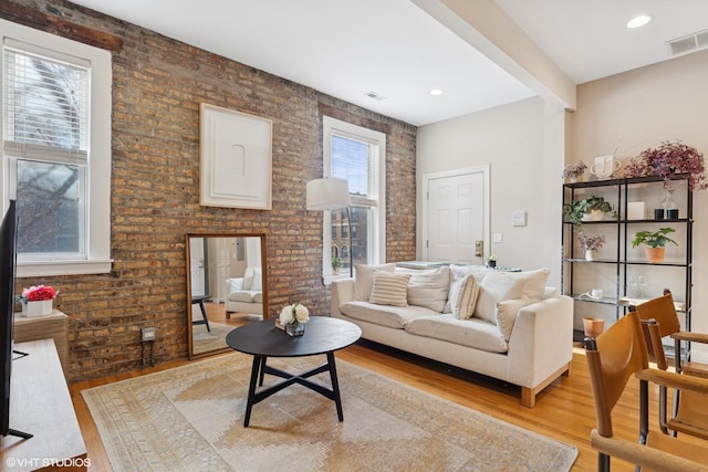 1019 N Washtenaw Ave Unit 2, Chicago, IL 60622 - living area with light wood finished floors and brick wall