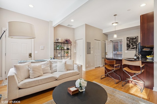 1019 N Washtenaw Ave Unit 2, Chicago, IL 60622 - living area featuring electric panel, light wood-type flooring, baseboards, and recessed lighting