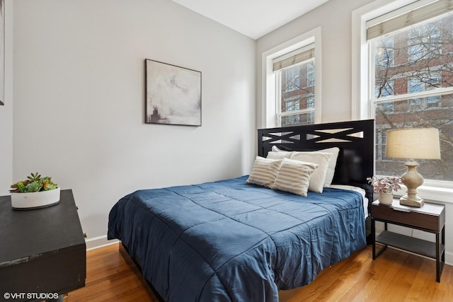 1019 N Washtenaw Ave Unit 2, Chicago, IL 60622 - bedroom with wood finished floors and baseboards