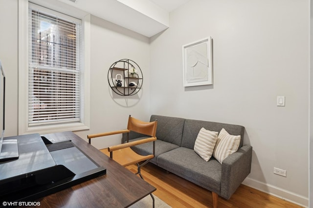 1019 N Washtenaw Ave Unit 2, Chicago, IL 60622 - living area with wood finished floors, an office area, and baseboards