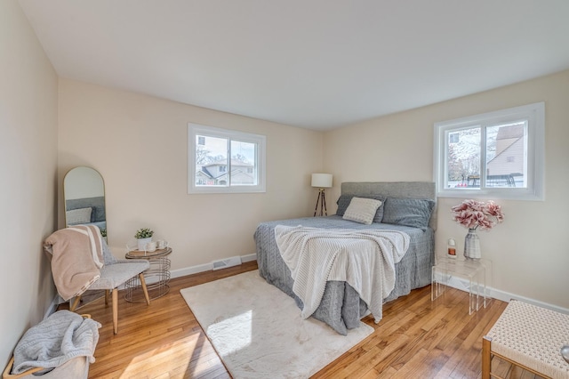 16112 Turner Ave, Markham, IL 60428 - bedroom featuring baseboards, visible vents, multiple windows, and hardwood / wood-style floors