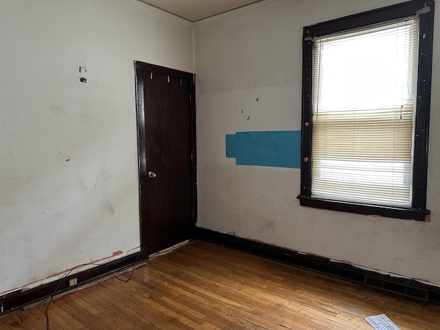 8444 S Essex Ave, Chicago, IL 60617 - unfurnished room with a wealth of natural light and wood finished floors