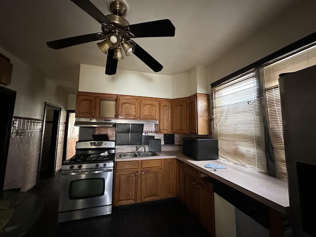 8444 S Essex Ave, Chicago, IL 60617 - kitchen featuring a sink, light countertops, ceiling fan, under cabinet range hood, and gas stove
