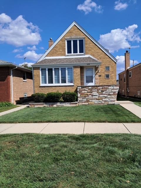 5705 S Mayfield Ave, Chicago, IL 60638 - bungalow-style home with a chimney, a front lawn, and brick siding