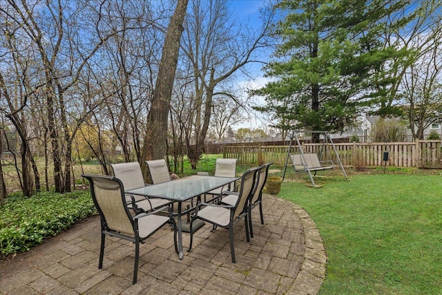 view of patio / terrace featuring outdoor dining area and fence