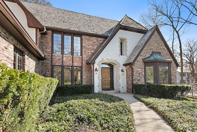 4001 Wyndwood Dr, Crystal Lake, IL 60014 - tudor-style house featuring brick siding and stucco siding