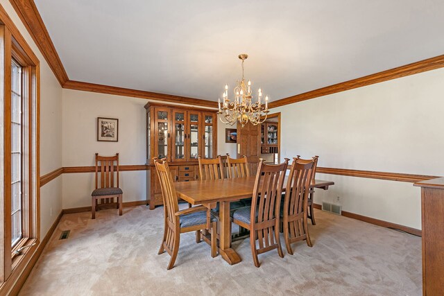 4001 Wyndwood Dr, Crystal Lake, IL 60014 - dining space featuring crown molding, visible vents, light colored carpet, and a chandelier