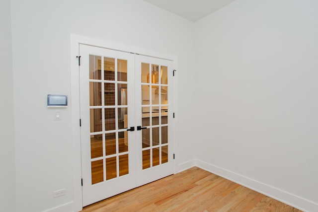 3621 N Richmond St, Chicago, IL 60618 - empty room featuring french doors, baseboards, and wood finished floors