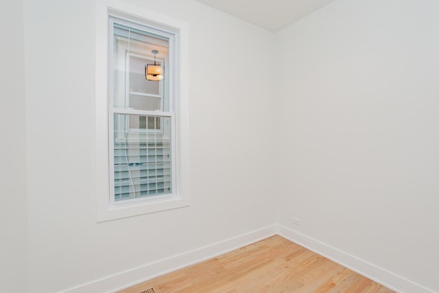 3621 N Richmond St, Chicago, IL 60618 - unfurnished room with light wood-style floors and baseboards
