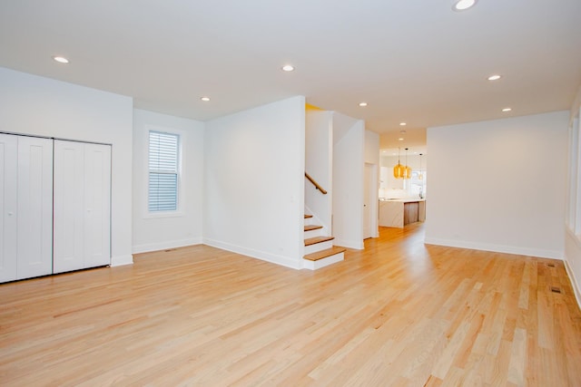 3621 N Richmond St, Chicago, IL 60618 - interior space featuring stairway, baseboards, light wood finished floors, and recessed lighting