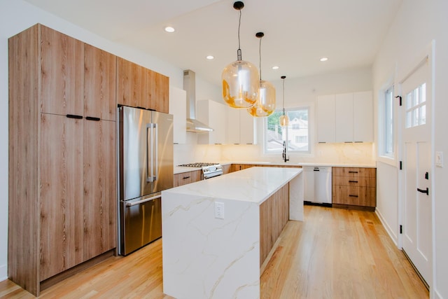 3621 N Richmond St, Chicago, IL 60618 - kitchen featuring modern cabinets, wall chimney range hood, high quality fridge, dishwashing machine, and light wood-style flooring