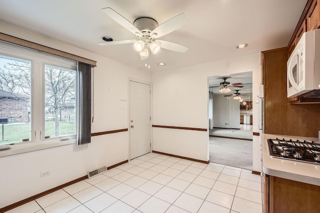 spare room featuring visible vents, baseboards, a ceiling fan, recessed lighting, and light tile patterned flooring