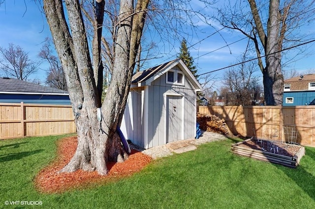 view of shed with a fenced backyard