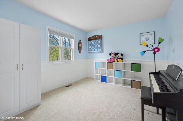 interior space featuring visible vents and carpet