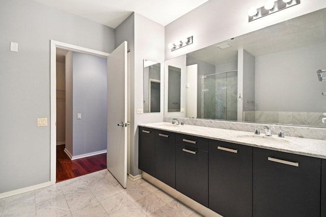 65 E Monroe St Unit 4521, Chicago, IL 60603 - bathroom with double vanity, marble finish floor, a sink, and a stall shower