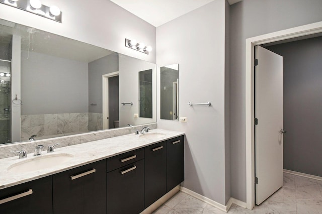 65 E Monroe St Unit 4521, Chicago, IL 60603 - full bathroom featuring baseboards, marble finish floor, and a sink