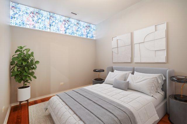 65 E Monroe St Unit 4521, Chicago, IL 60603 - bedroom featuring baseboards and wood finished floors