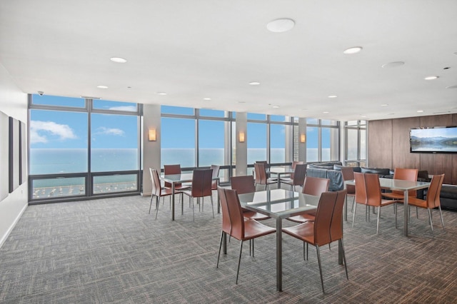 65 E Monroe St Unit 4521, Chicago, IL 60603 - carpeted dining room with recessed lighting, a wall of windows, and a water view