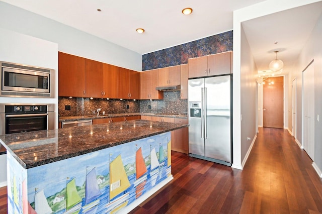 65 E Monroe St Unit 4521, Chicago, IL 60603 - kitchen featuring backsplash, dark wood-style floors, under cabinet range hood, and stainless steel appliances