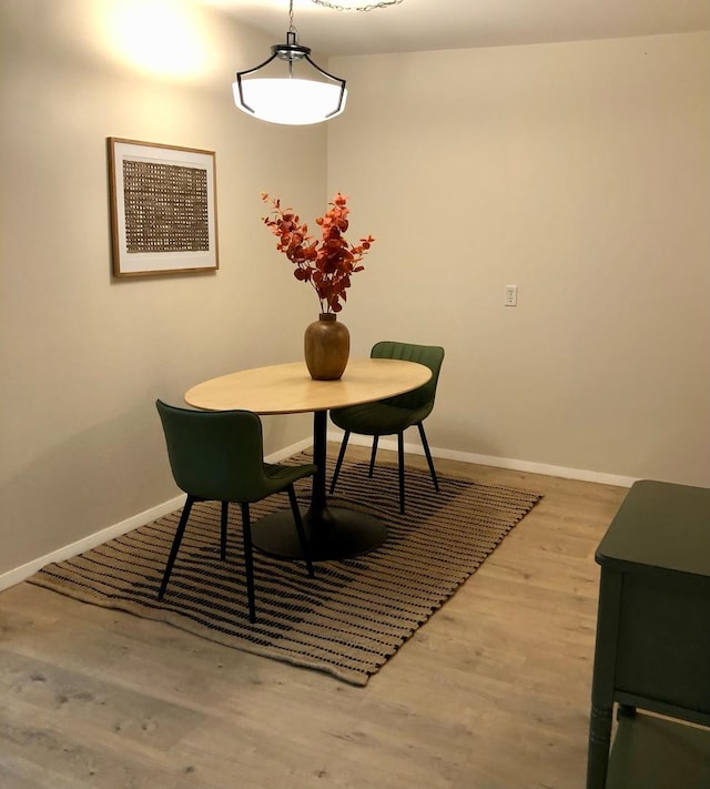 124 N Whistler Ave Unit B8, Freeport, IL 61032 - dining space with wood finished floors and baseboards