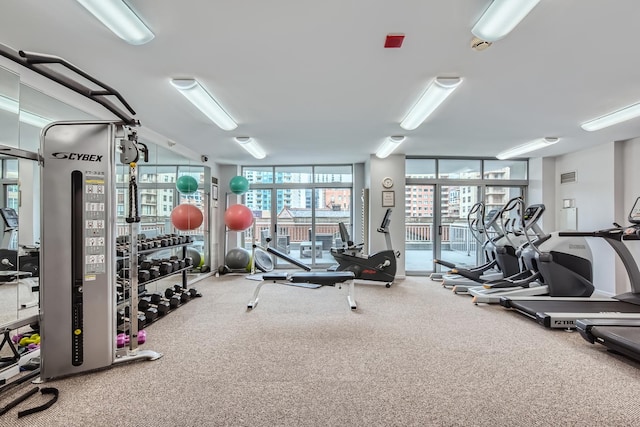 600 N Dearborn St Unit 710, Chicago, IL 60654 - exercise room with a wall of windows, carpet flooring, visible vents, and a healthy amount of sunlight