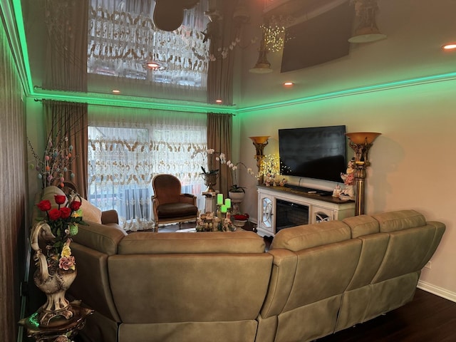 living room featuring wood finished floors and baseboards