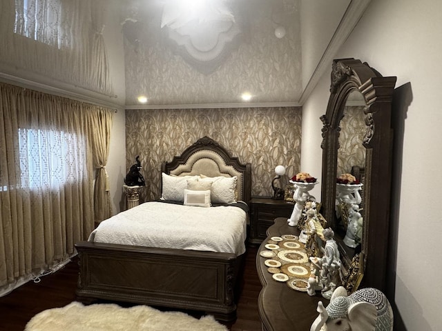 bedroom with vaulted ceiling and wood finished floors