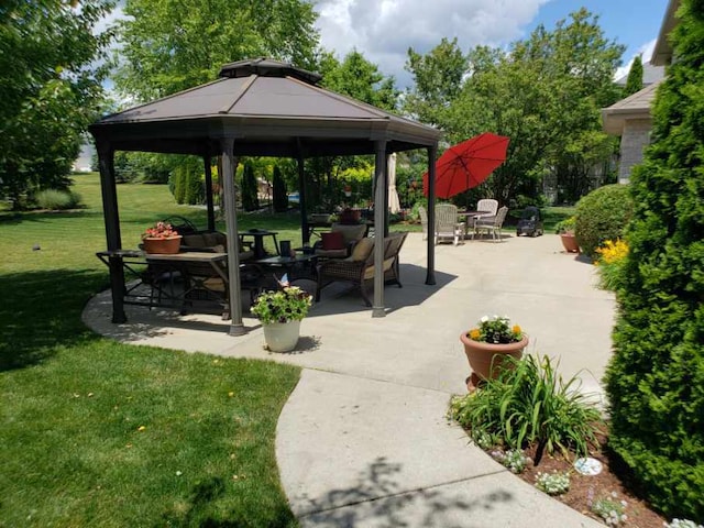 view of home's community with a gazebo, a patio, and a lawn