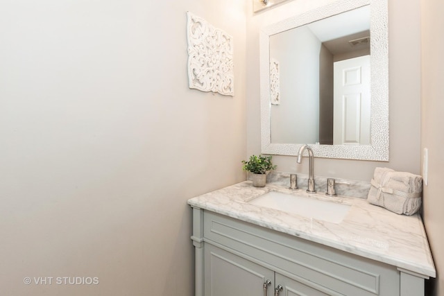 bathroom featuring visible vents and vanity