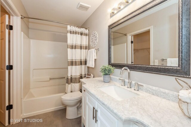 bathroom featuring tile patterned floors, shower / bath combo, toilet, visible vents, and vanity