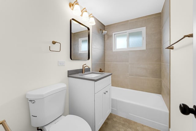 bathroom with toilet, bathing tub / shower combination, and vanity