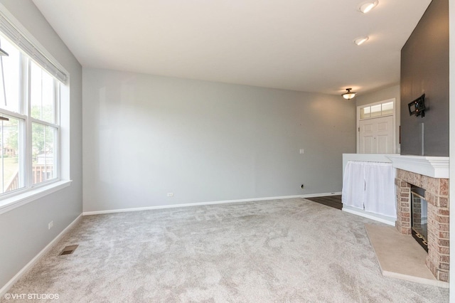 305 Fairmont Ct Unit 305, Saint Charles, IL 60175 - unfurnished living room with carpet floors and a brick fireplace