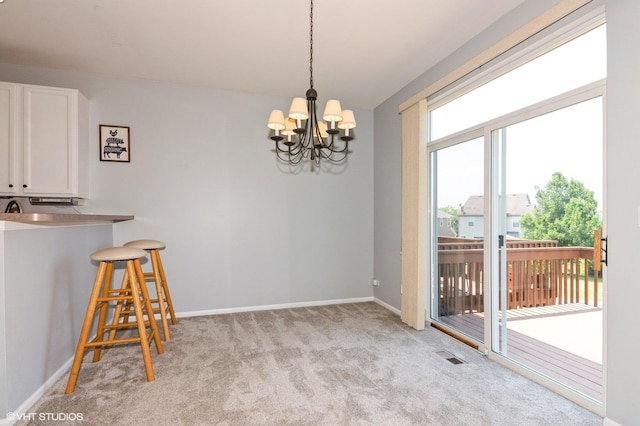 305 Fairmont Ct Unit 305, Saint Charles, IL 60175 - dining space featuring light carpet and a chandelier