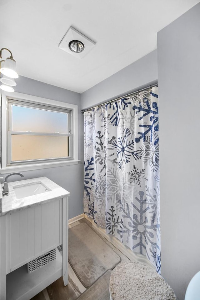 16050 Ellis Ave, South Holland, IL 60473 - bathroom featuring baseboards, vanity, and a shower with curtain