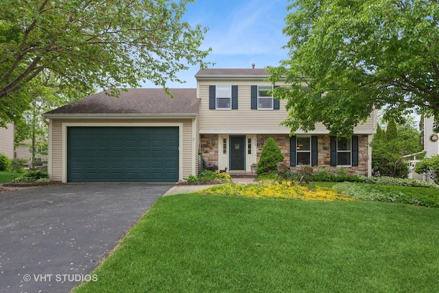 view of front of house with stone siding, a garage, driveway, and a front yard